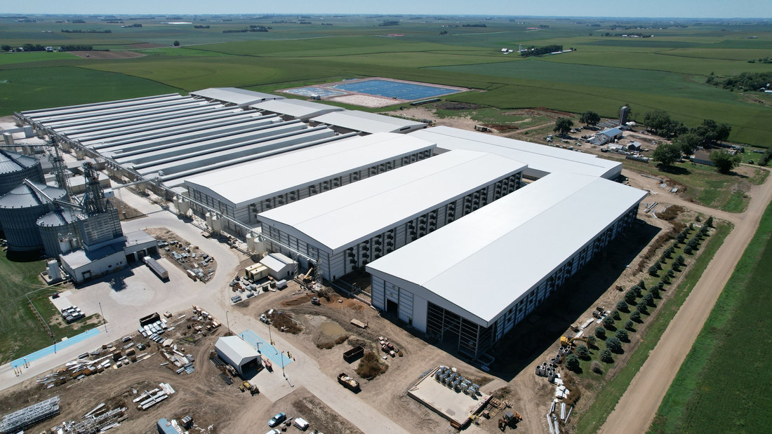 Aerial view of the completed white-roofed layer facility buildings in Iowa